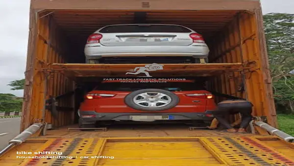 Hatchback ready for multi-car trailer transport in Vadodara